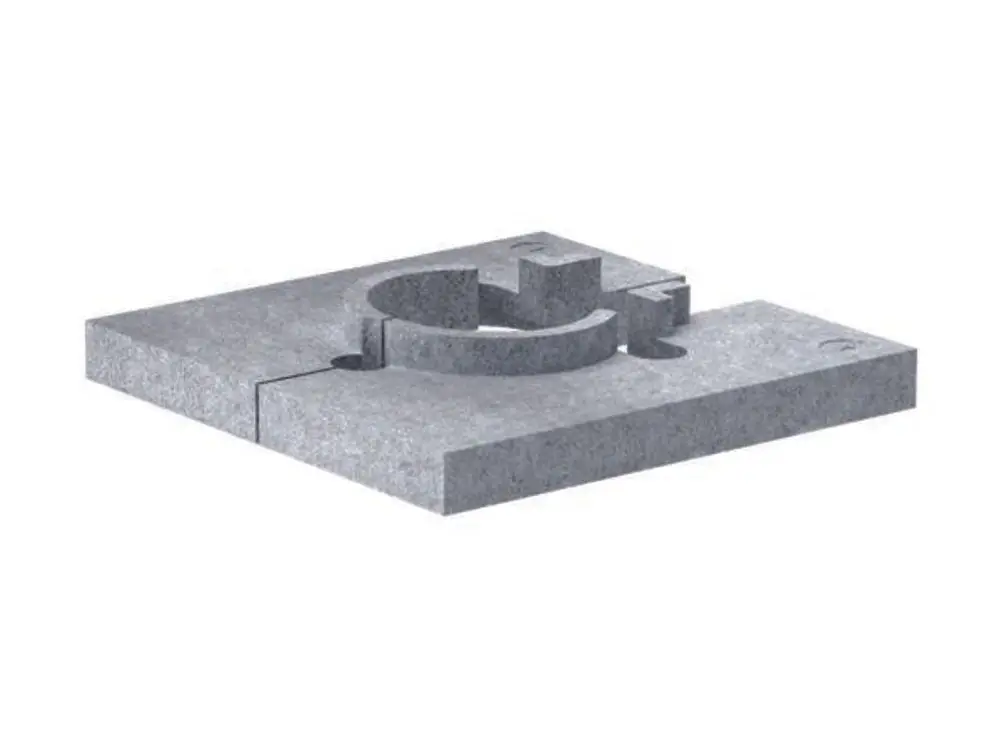 Montagehilfe aus grauem Material mit kreisförmiger Aussparung und einer Erhöhung. Eignet sich für die Installation von Dallmer Entwässerungssystemen.