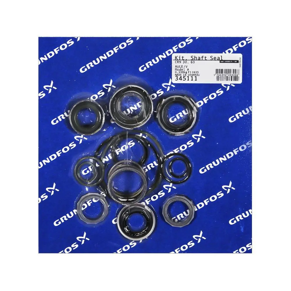 Grundfos Ersatzteilset mit mehreren Gleitringdichtungen auf blauer Unterlage. Dichtungen in verschiedenen Größen gruppiert.