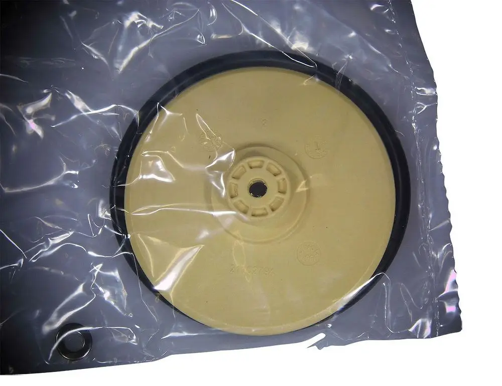 Grundfos Ersatzteil, bestehend aus einem runden Laufrad in einer transparenten Verpackung. Die Oberfläche zeigt eine helle Farbe mit einem schwarzen Rand.