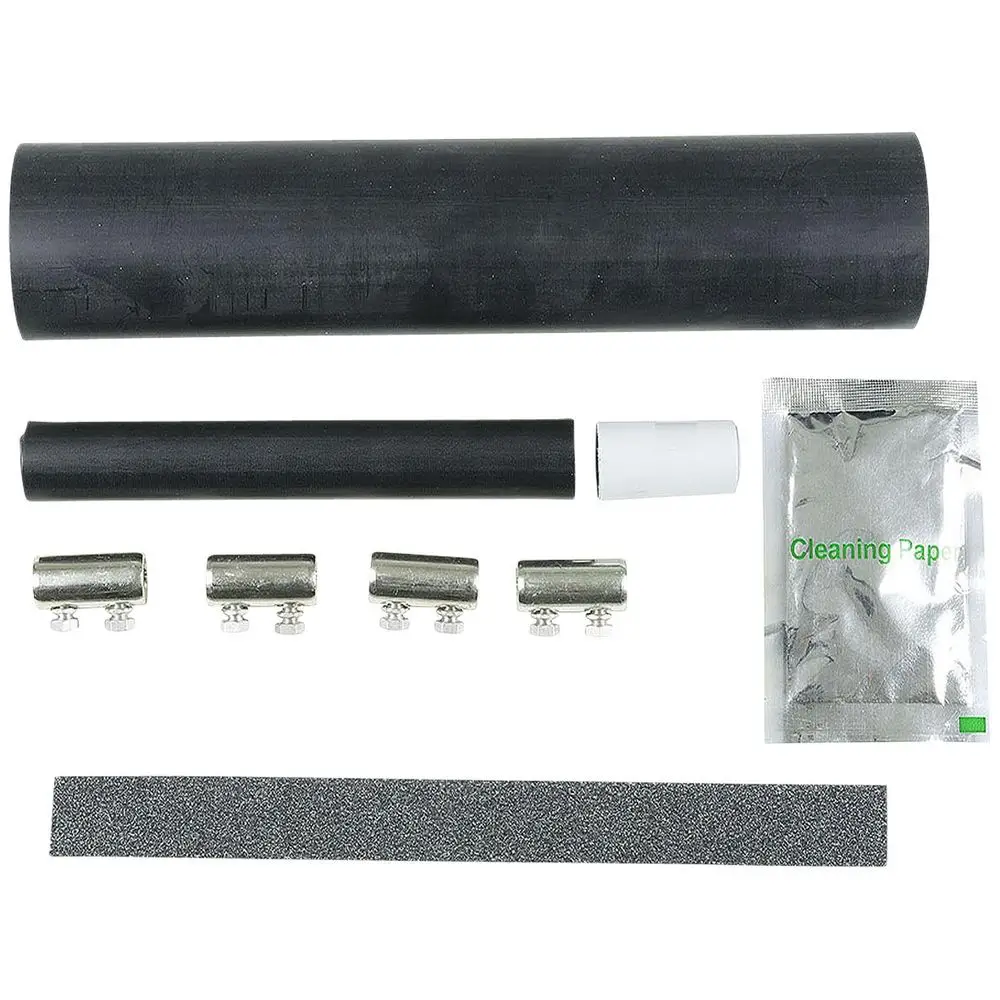 Set mit verschiedenen Komponenten für Unterwasserpumpen von Grundfos, einschließlich Schrumpfmuffe, Verbindern, Reinigungspapier und Schleifpapier.