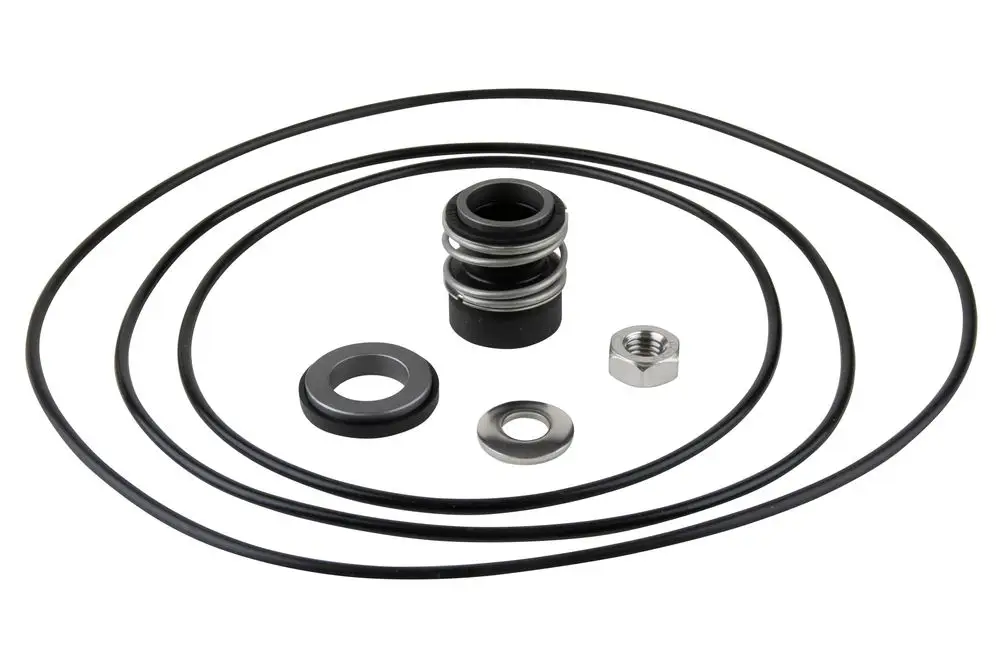 Set bestehend aus mehreren Gleitringdichtungen und O-Ringen, geliefert von Wilo, für mechanische Anwendungen. Zubehörteile in schwarzer und silberner Farbe angeordnet.