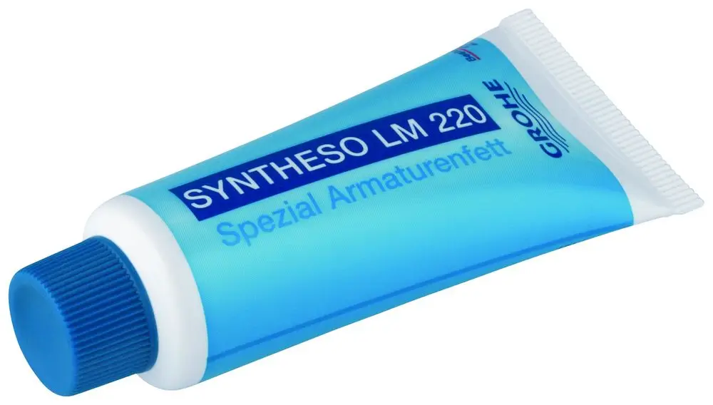 Blauer Tube mit Kunststoffverschluss, beschriftet mit "Spezial Armaturenfett" und "Grohe". Tube enthält eine fettartige Substanz für Armaturenpflege.