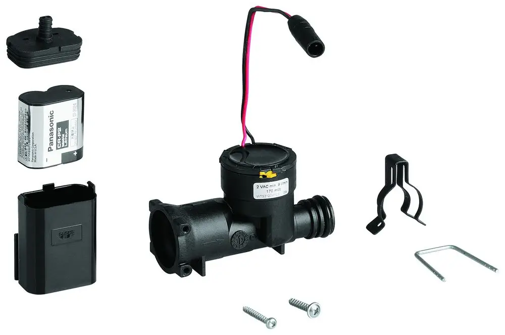 GROHE Generator mit einem schwarzen Gehäuse, Kabelanschluss, und Zubehörteilen wie Schrauben, Halterungen und einem Batteriefach in einer übersichtlichen Anordnung.