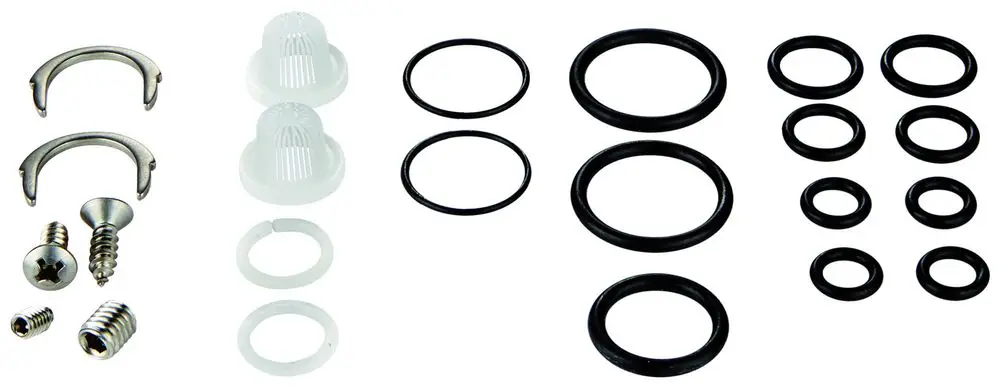 GROHE Dichtungsset mit verschiedenen Dichtungen, Ringen, Schrauben und Halterungen, angeordnet auf hellem Hintergrund.