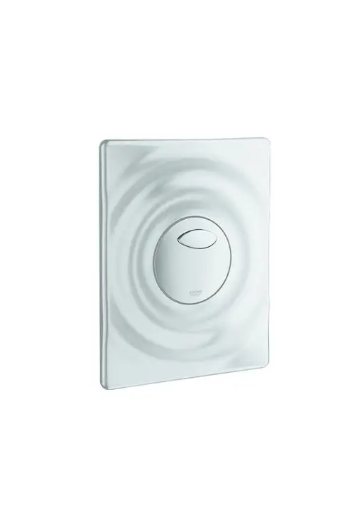 Betätigung für ein WC in mattem Design, mit runder Druckfläche. Die Konstruktion zeigt eine leicht gewellte Oberfläche. Produkt von Grohe.