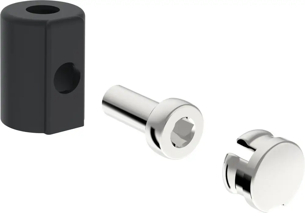 Drei Metallteile in unterschiedlichen Formen, darunter eine schwarze Kappe und zwei silberne Elemente, die möglicherweise für Armaturen von HANSA verwendet werden.