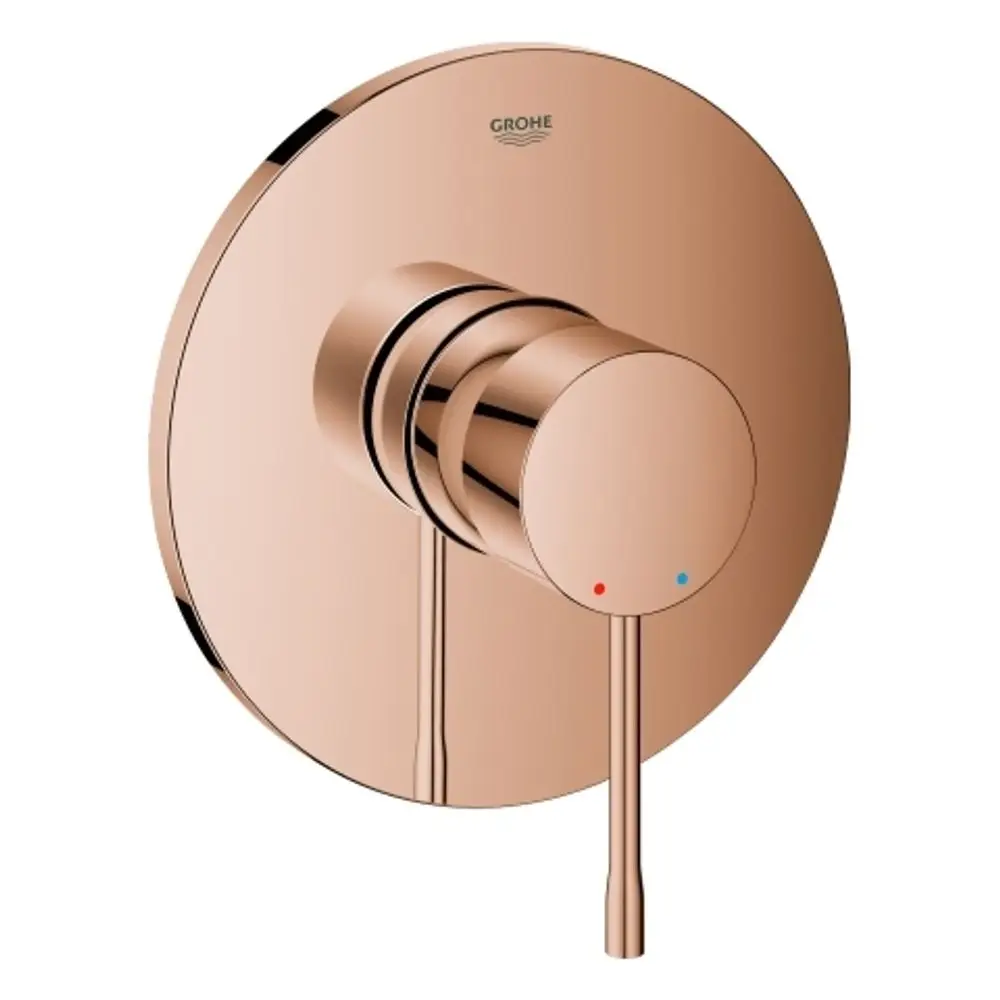 Roségoldene GROHE-Brausebatterie mit rundem Design und Bedienknopf für Temperaturregelung. Zwei farbige Markierungen für warm und kalt.