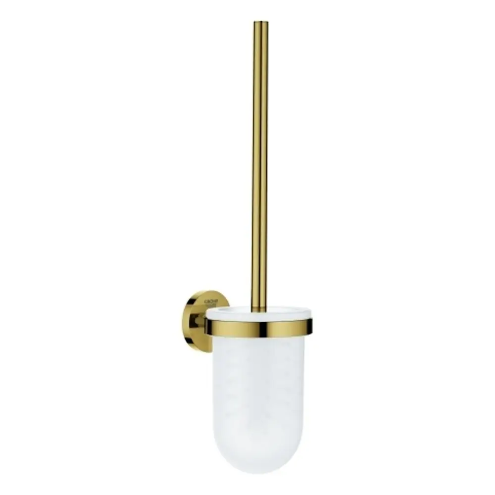 Wandmontierte Toilettenbürstengarnitur aus Metall mit einem goldenen Griff und einem transparenten Behälter. Das Produkt ist von Grohe und eignet sich für Badezimmeranwendungen.