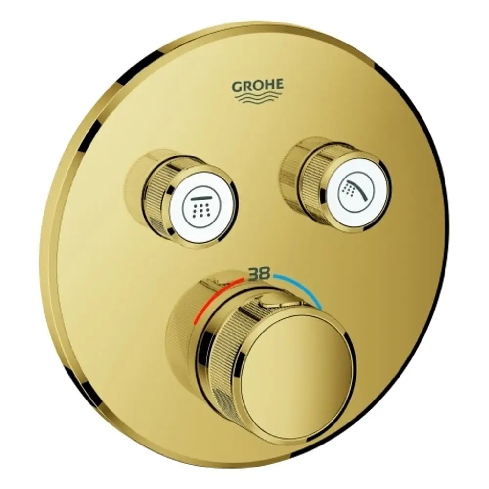 Thermostatsteuerung in goldfarbenem Design von Grohe, mit drei Reglern zur Einstellung von Wassertemperatur und Auslaufoptionen für Dusche oder Handbrause.