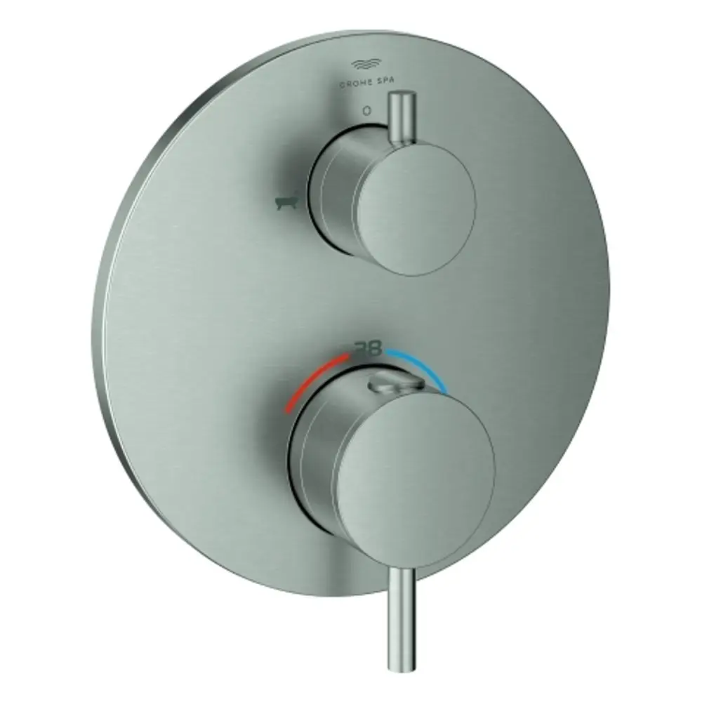 GROHE Thermostat-Wannenbatterie mit zwei Drehknöpfen zur Temperatur- und Wasserregulierung auf runder, flacher Grundplatte in Edelstahloptik.