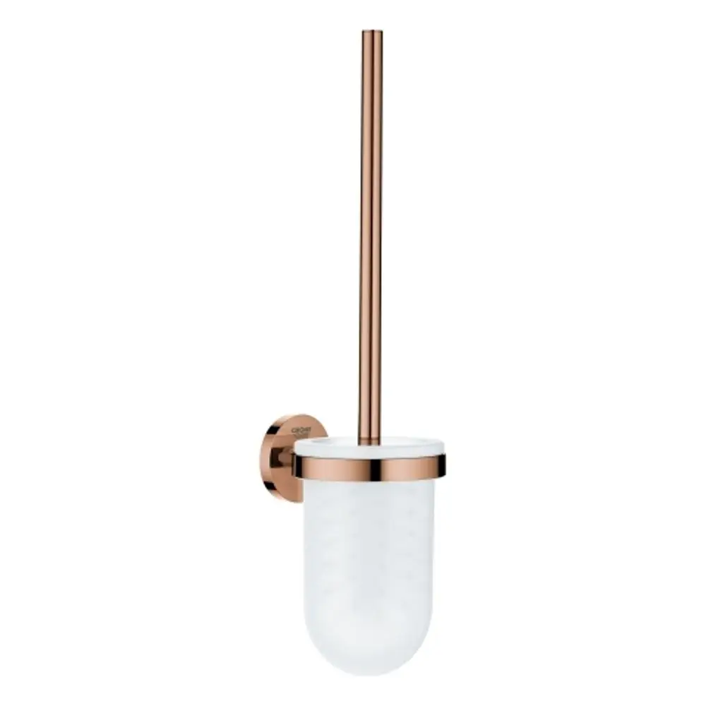 Wandmontierte Toilettenbürstengarnitur von Grohe mit einem roségoldenen Halter und einem weißen Behälter. Der Bürstenstiel ist vertikal angeordnet.