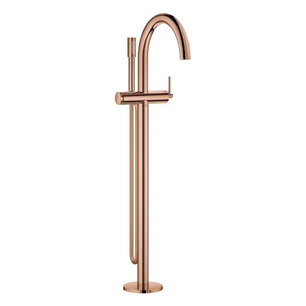 Grohe-Wannenbatterie in warmem Sunset-Finish, freistehend mit gewölbtem Auslauf und Handbrause, geeignet für Bodenmontage.