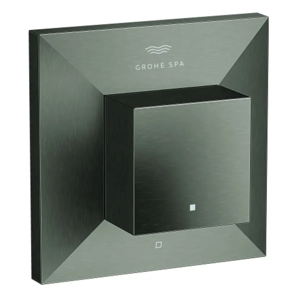 Wandmontierte Steuerungseinheit von Grohe in gebürstetem Graphit. Quadratisches Bedienfeld mit zentralem Drehknopf und zwei Symbolen unterhalb.