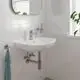 Grohe-Waschtischarmatur in Chrom mit PushOpen Ablaufgarnitur, montiert an einem schlichten weißen Waschbecken in einem hellen Badezimmer.