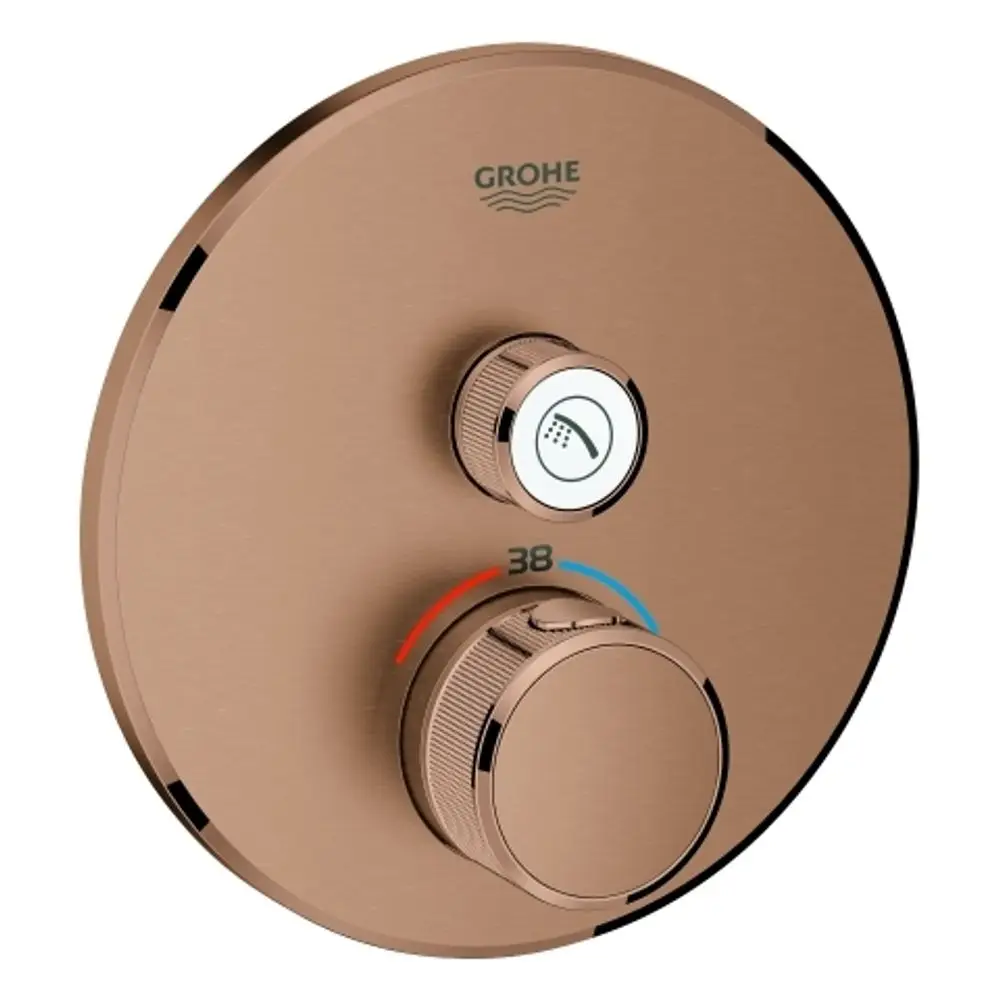 Thermostat von Grohe mit runder Oberfläche, zwei Drehreglern zur Temperatureinstellung und Wasserumleitung, ausgeführt in warmem Sunset-Finish.