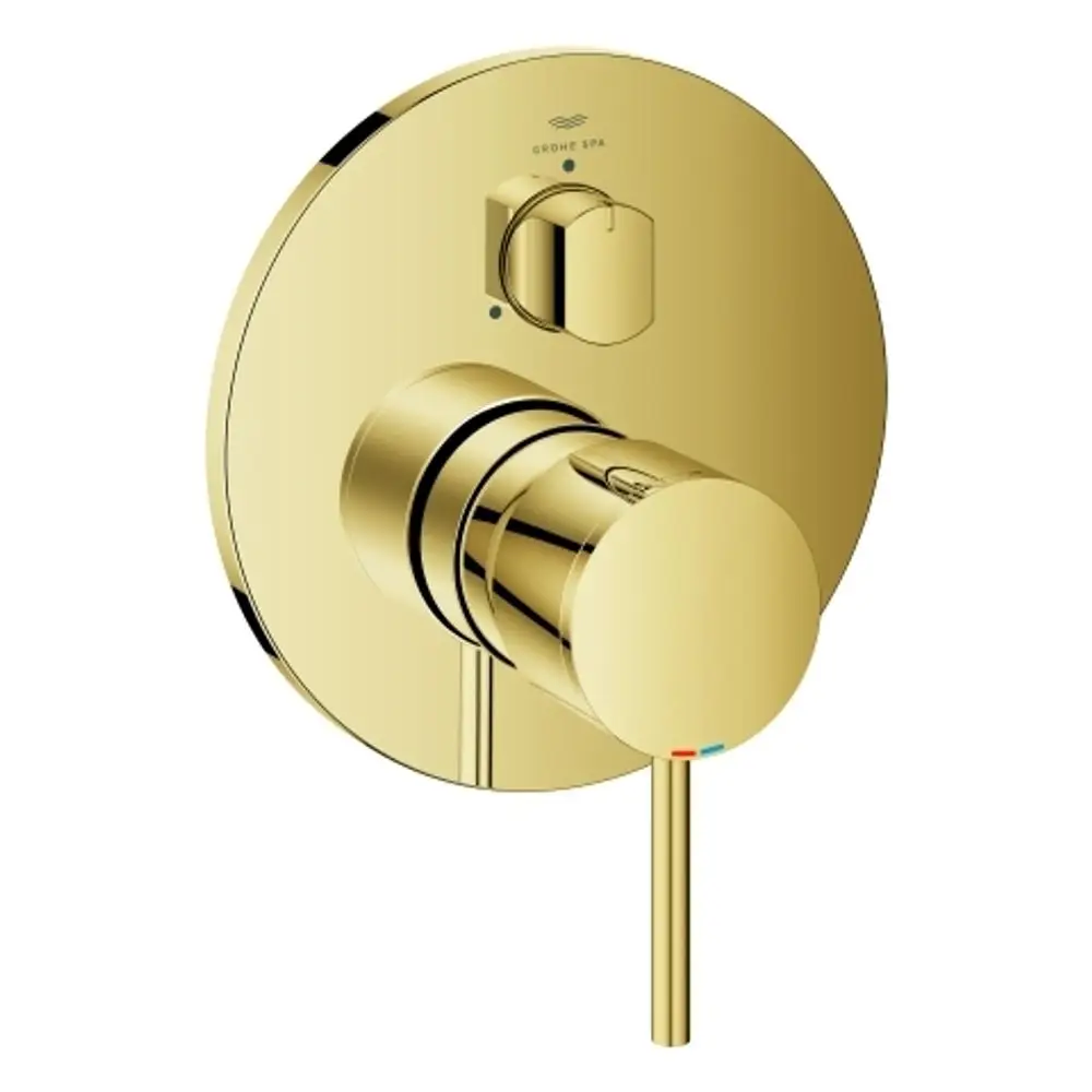 Goldene Wandarmatur von Grohe mit einem runden Bedienfeld und zwei Drehknöpfen, einem für die Temperaturregelung und einem für die Wasserumstellung.