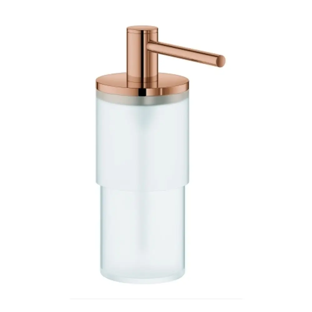 Transparenter Seifenspender mit einem Roségold-Touch. Der Spender gehört zur Grohe Allure-Serie und hat eine elegante, schlichte Form ohne zusätzliche Beschriftungen.