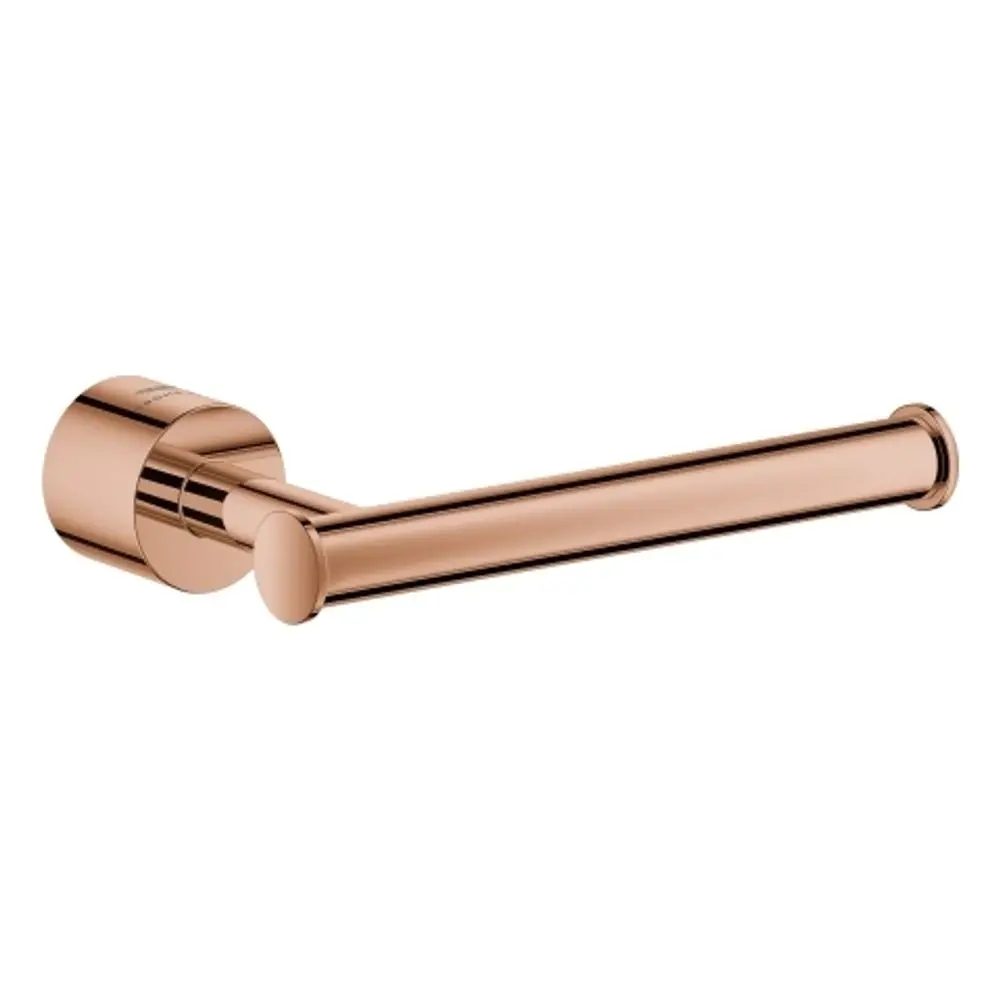 GROHE WC-Papierhalter in einem warmen Kupferton mit runder Halterung und einem schlichten, geraden Papierhalter in moderner Ausführung.