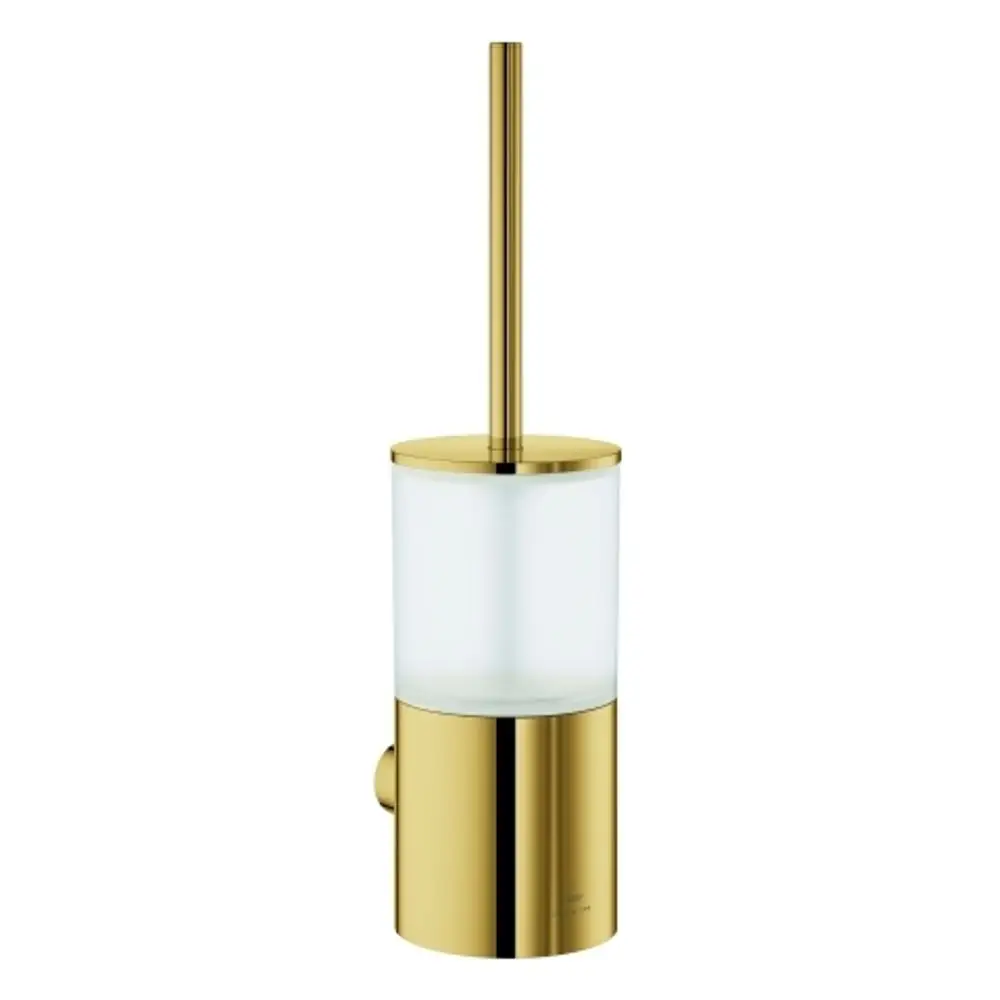 Wandmontierte Toilettenbürstengarnitur in glänzender goldener Optik, mit transparentem Behälter und einem Bürstenstiel von Grohe.