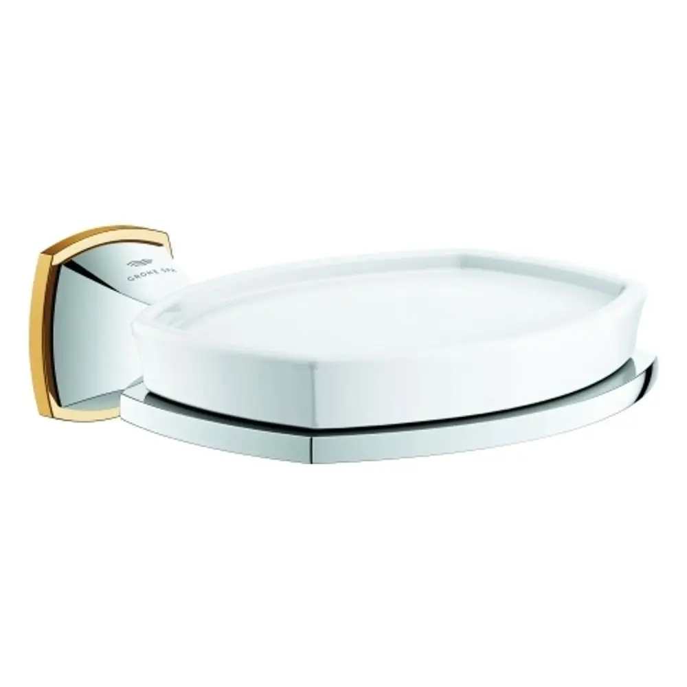 Seifenschale mit Halterung in chrom und gold, entworfen von Grohe. Die Halterung ist an der Wand montiert und ermöglicht die Nutzung der Schale für Seife oder ähnliche Gegenstände.