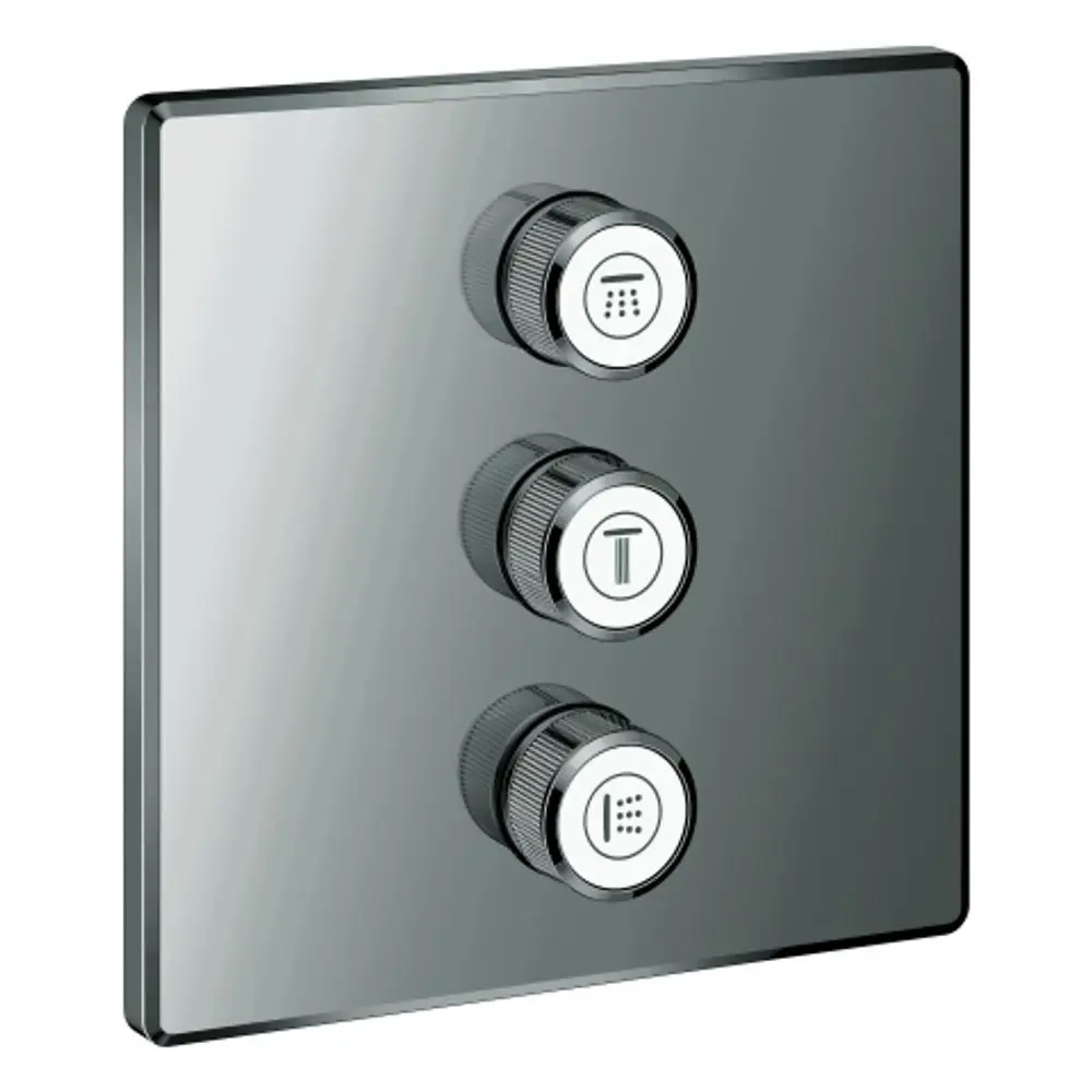 GROHE Bedienfeld mit drei Drehknöpfen auf einer rechteckigen, glatten Oberfläche. Die Knöpfe sind mit Symbolen für verschiedene Funktionen versehen.