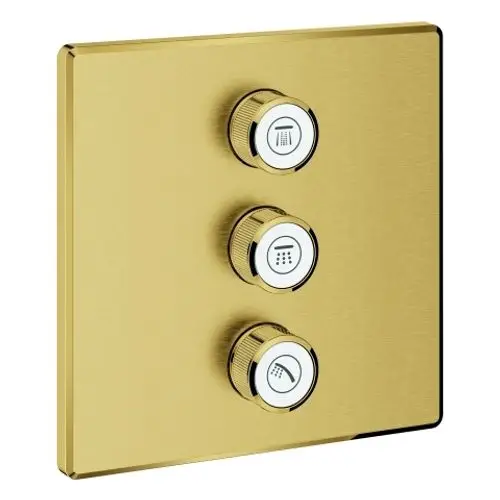 Drei Drehregler auf einer goldenen Oberfläche, die zur Steuerung von Wasserströmen dienen, mit Symbolen für verschiedene Ausgänge, hergestellt von Grohe.
