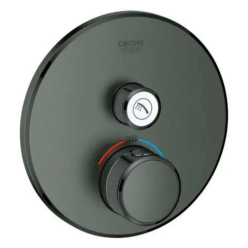 Runde Thermostatsteuerung von Grohe mit zwei Reglern, einem für den Temperaturbereich und einem für die Wasserquelle, auf einer grauen Oberfläche.