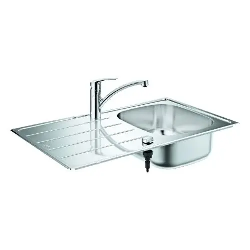 Edelstahlspüle mit integriertem Wasserhahn von Grohe, abgerundeten Kanten und einem Ablagebereich, montiert auf einer glatten Oberfläche.