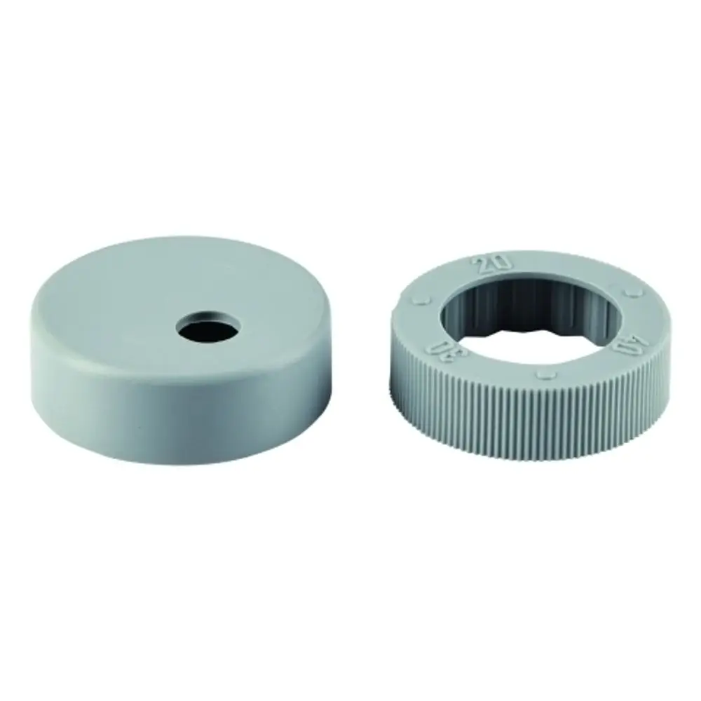 Zwei graue Kunststoffteile, ein flacher Deckel und ein gewellter Ring mit Aussparung in der Mitte, möglicherweise für Grohe Armaturen.