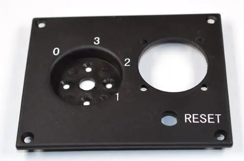 Bedienpanel mit drei Ziffern 0 bis 3 und der Aufschrift "RESET". Teil eines Zubehörs von Remko zur Steuerung einer Zusatzsteckdose.