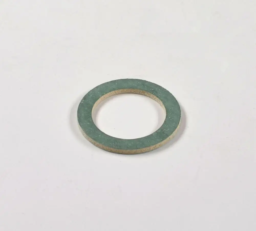 Remko-Dichtung für einen Durchflusssensor, rund und aus einem kompakten Material mit grünem Außenring und beigem Innenbereich, auf weißem Untergrund.