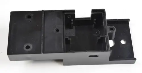 Schwarze Halterung mit Aussparungen und Löchern, möglicherweise für einen Sensor. Produkte von Remko sind oft für Lüftungs- und Klimaanlagen konzipiert.