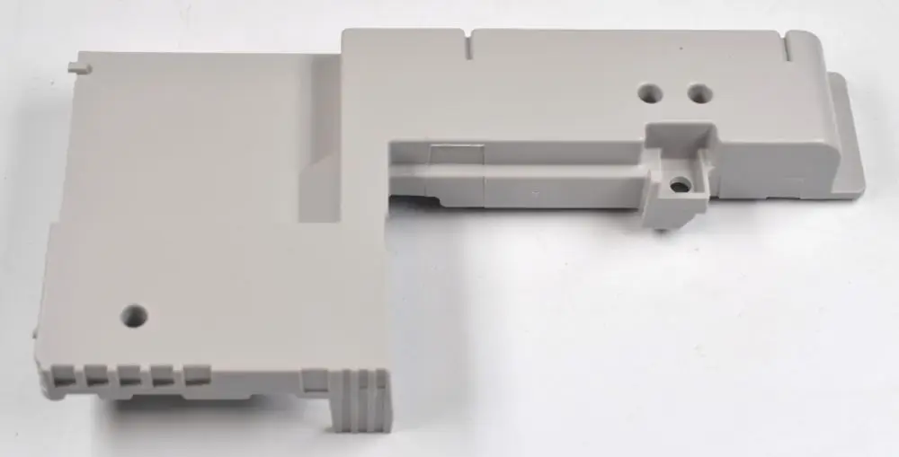 Graue Kunststoffabdeckung, passend für elektronische Bauteile. Teile von Remko zur Sicherung oder Abdeckung der Platine, ohne spezifische Maße oder Details erkennbar.