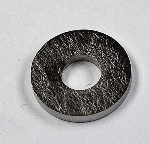 Gasmembran in rundem Design mit zentralem Loch, hergestellt von Remko. Material sieht strukturiert aus, geeignet für verschiedene Anwendungen.