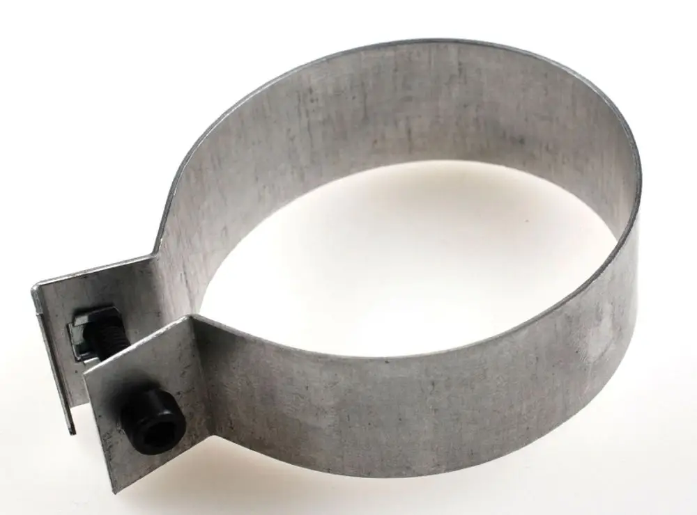 Metallischer Luftschieber mit einer Halterung und Schraube, geeignet für Anwendungen von Remko. Er hat eine runde Form und eine offene Struktur.