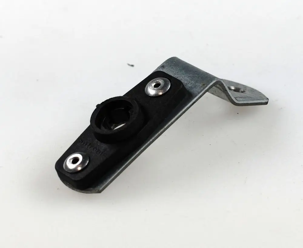 Halterung aus Metall und Kunststoff mit zwei Schraublöchern, geeignet zur Montage von Fotozellen. Produkt von Remko, funktional und robust.
