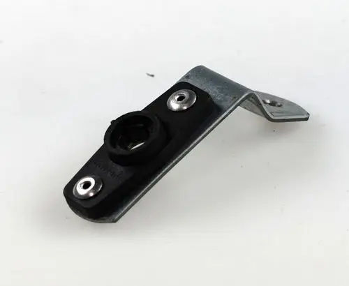 Halterung aus Metall und Kunststoff mit zwei Schraublöchern, geeignet zur Montage von Fotozellen. Produkt von Remko, funktional und robust.