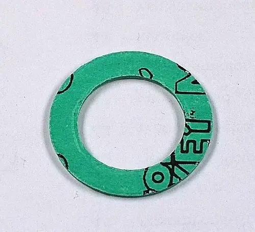 Grüne Dichtung mit mittigem Loch und schwarzer Markierung, möglicherweise für eine Remko-Apparatur. 