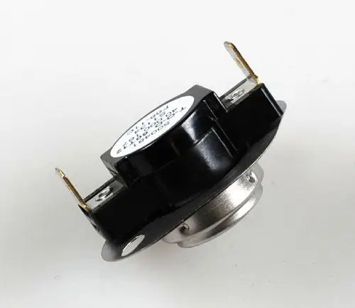 Nachkühlthermostat von Remko, schwarz, mit zwei Anschlussklemmen und einem runden Aluminiumgehäuse. Gezeigt von der Seite auf einem weißen Hintergrund.
