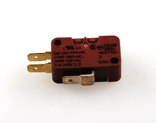 Mikroschalter von Remko mit zwei goldenen Anschlussstiften und einem seitlichen Kontakt, beschriftet mit elektrischen Spezifikationen.