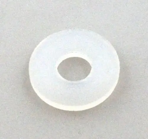 Durchsichtige Dichtung aus Nylon mit mittigem Loch, geeignet für Verwendung in Verbindungselementen von Remko Produkten. Flache, runde Form ohne erkennbare Maße.