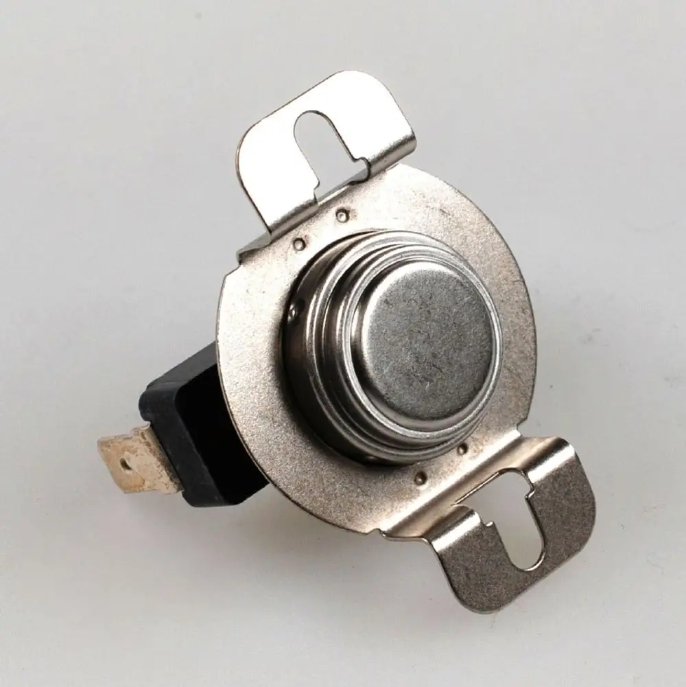 Temperaturbegrenzer von Remko mit metallischem Gehäuse und zwei Anschlussklemmen. Runde Mechanik zur Temperaturregelung erkennbar.
