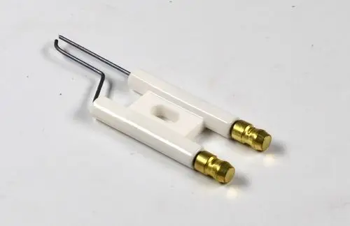 Zündelektrode von Remko in weißer Farbe mit zwei goldfarbenen Anschlüssen und einem Metallbügel. Optimal für Anwendungen im Bereich der Zündung.