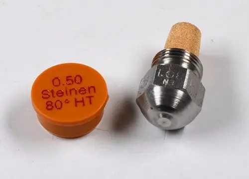 Remko Düse aus Metall mit einem orangefarbenen Verschluss. Die Düse hat eine beige Filterkomponente und ist in einem technischen Kontext erkennbar.