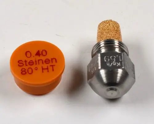 Düse aus Metall mit einem goldfarbenen Filteraufsatz, neben einer orangefarbenen Kappe. Produkt gehört zur Marke Remko und wird in der Heiztechnik verwendet.