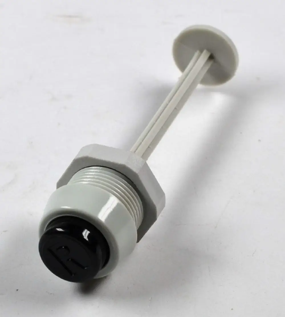 Entriegelungselement für Motorschutzschalter, erkennbar an schwarzem Knopf und Schraubengewinde. Produkt von Remko.