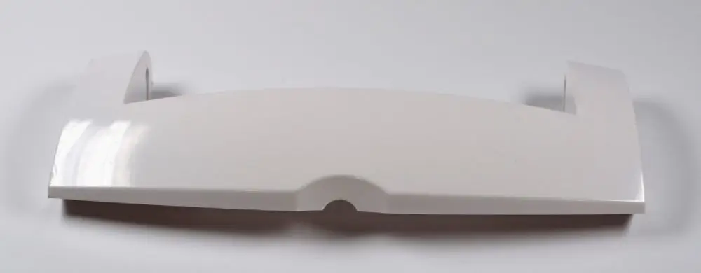 Weißer Kunststoffgriff für den Transport, eventuell passend für Geräte von Remko. Flaches Design mit seitlichen Halterungen, auf einem neutralen Hintergrund abgebildet.