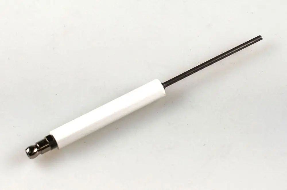 Zündelektrode von Remko, mit einer weißen Isolierung und einem langen, dünnen Metallstift. Geeignet für bestimmte Heizsysteme.