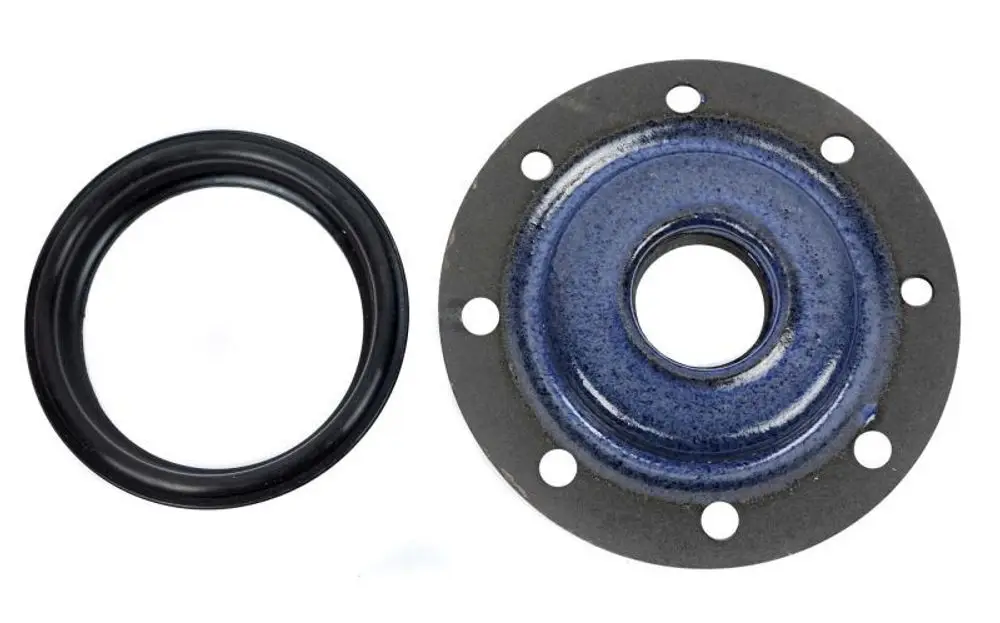 Flansch mit Dichtung, geeignet für Heizungsinstallationen. Enthält einen schwarzen Gummidichtungsring und eine metallische Platte mit Löchern zur Befestigung.