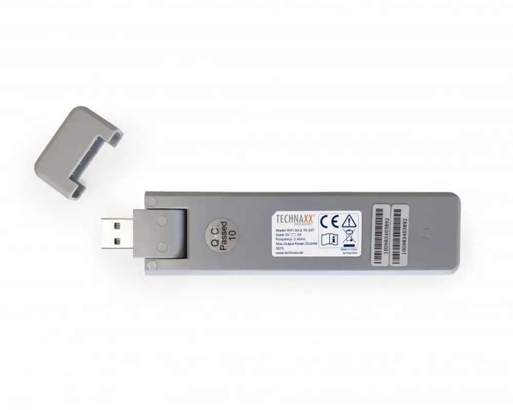 Technaxx WiFi Stick mit USB-Anschluss, grauem Gehäuse und abnehmbarem Schutzdeckel. Gezeigt sind die technischen Informationen und das Logo der Marke.